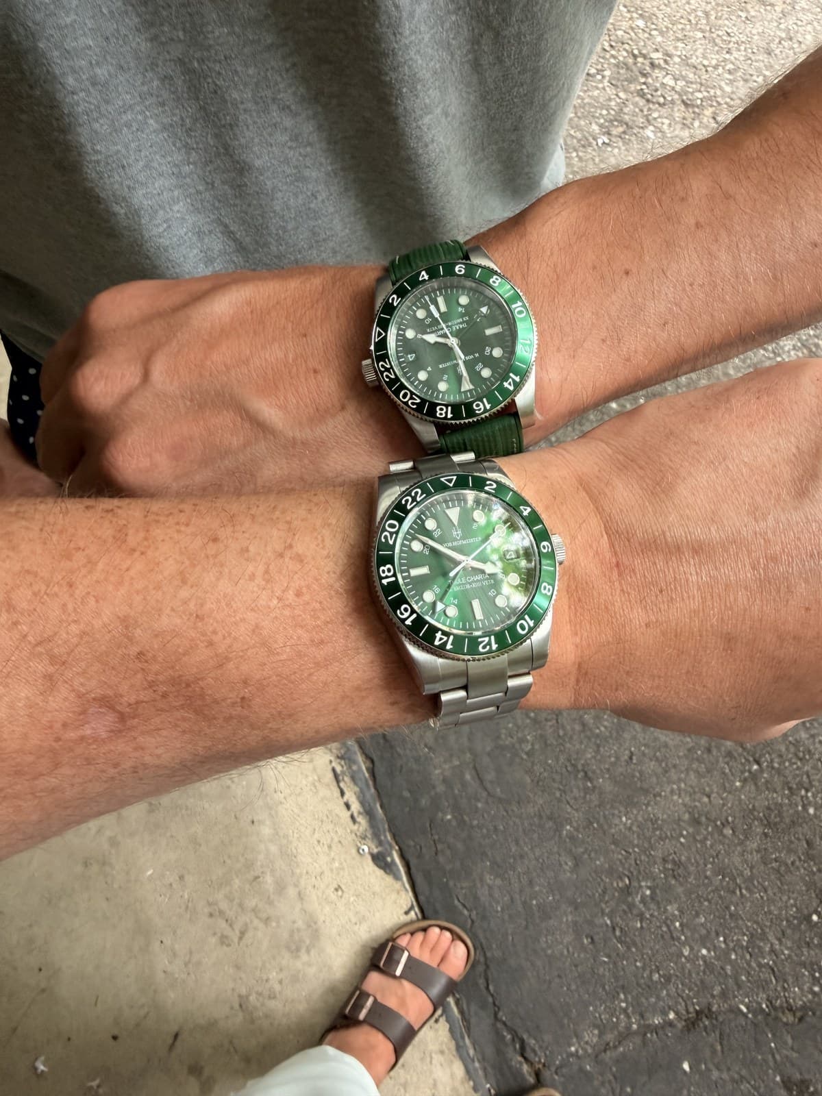 Two of the green watches, worn